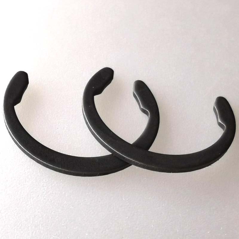Karbonstålfjær holder ringer